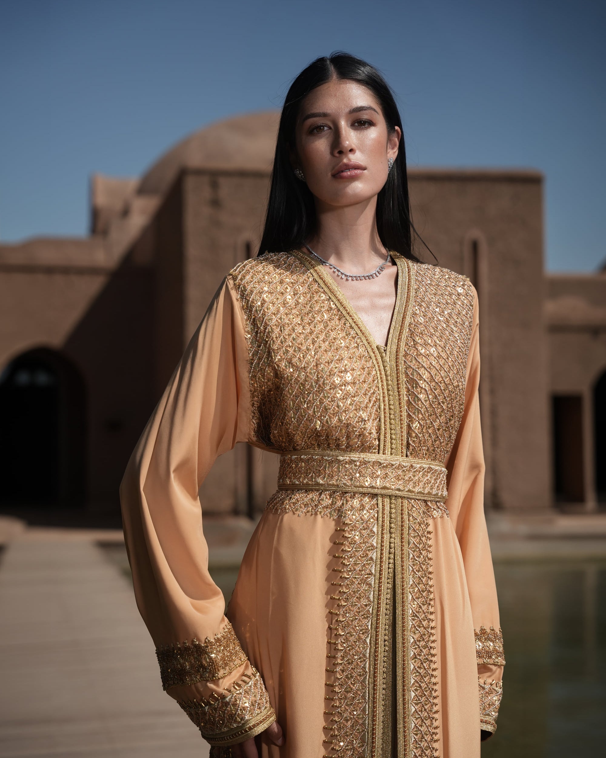 Amber Vigil apricot crepe Moroccan kaftan with a gold sequin mesh plastron at the neckline