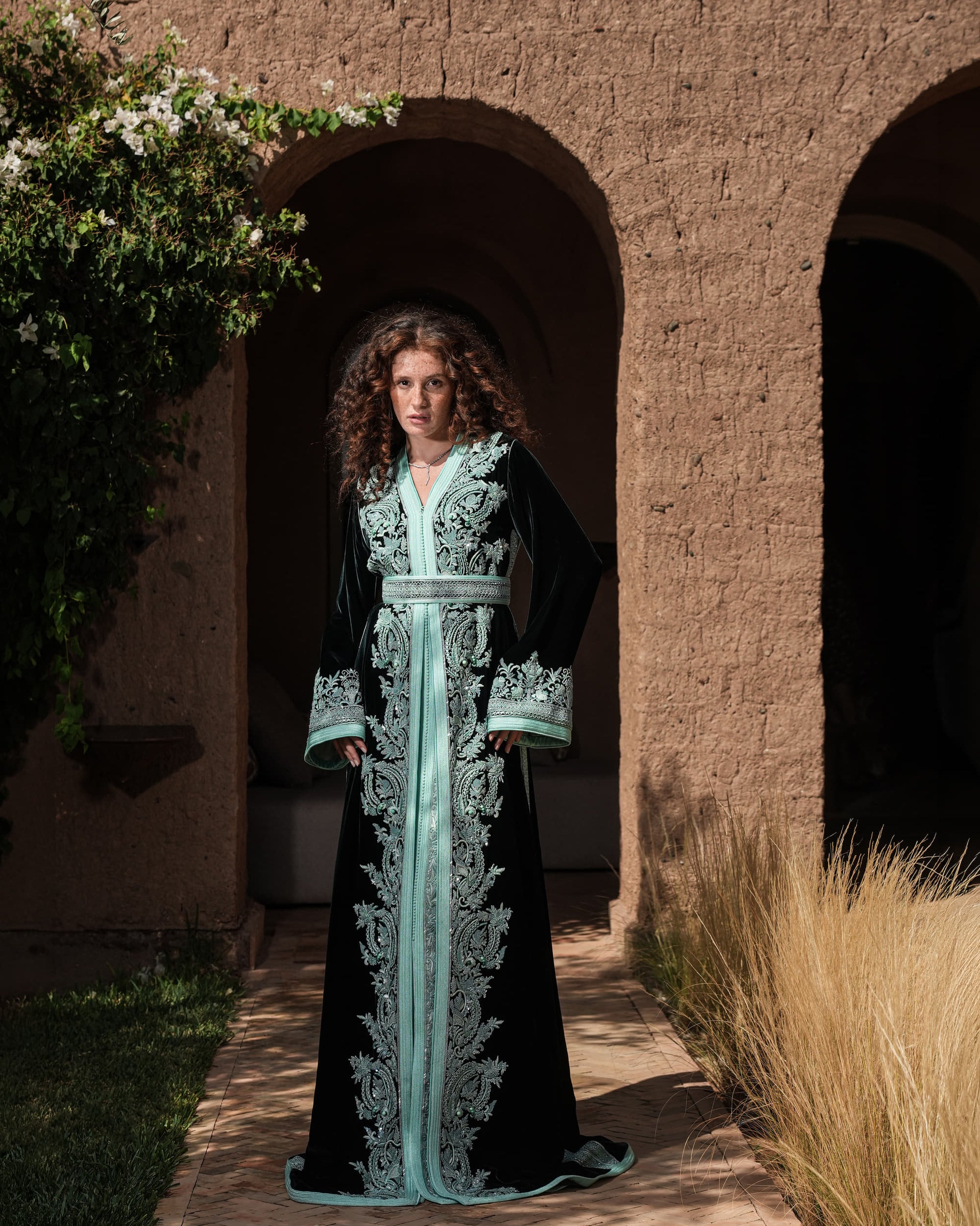 Cypress Portico deep green velvet Moroccan kaftan with sea-green embroidery, full-length view