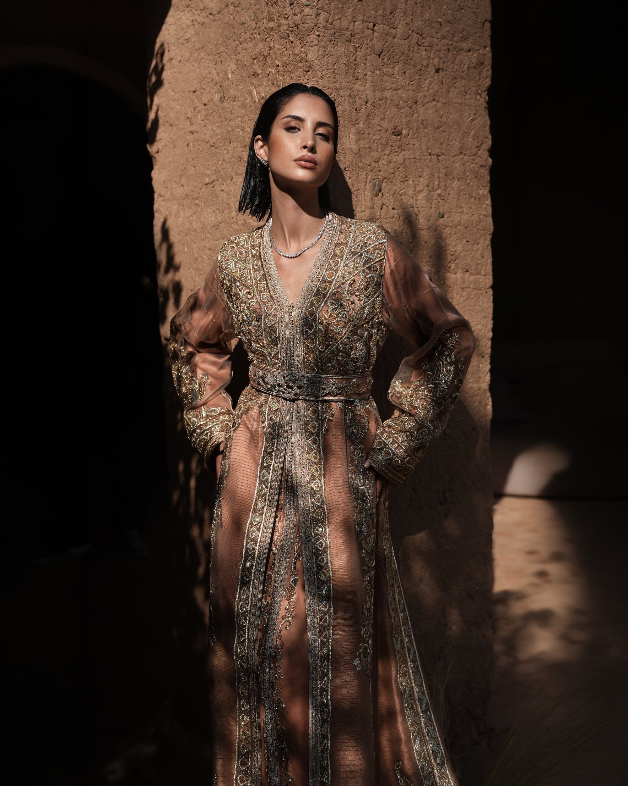 Rosewood Aurora copper-rose organza Moroccan kaftan with silver embroidery and jewelled belt, full-length view
