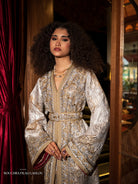 Or Solaire gold Moroccan kaftan with luminous embroidery and belted silhouette