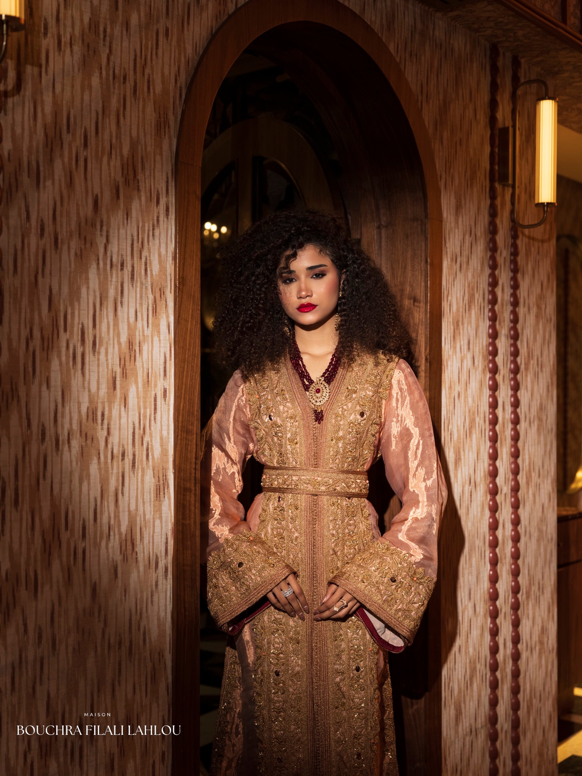 Rose and gold Moroccan caftan detail with ornate embroidery and refined bridal silhouette